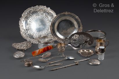 null A silver lot comprising a milk jug, a tripod egg cup, two heart-shaped dishes,...