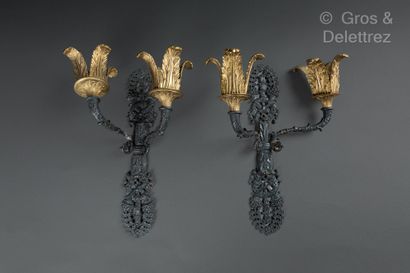 null Pair of ormolu and patinated sconces with two light arms.
Restoration period
31...