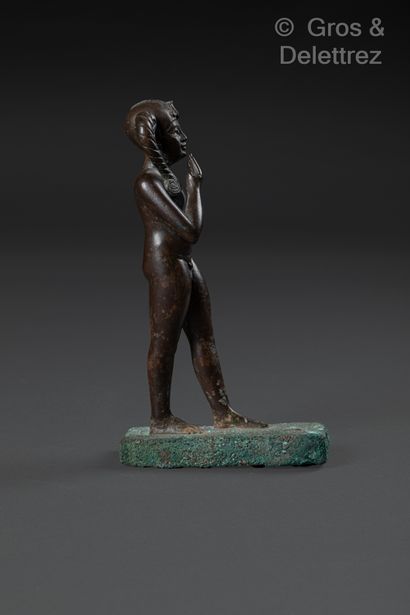 null Statuette of a standing nude Harpocrates, holding out his right index finger...