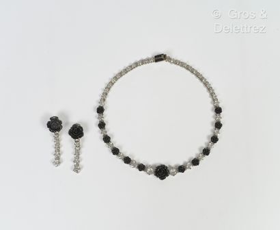null PRADA - Half-set in silver-plated rhinestones and black floral motif, consisting...