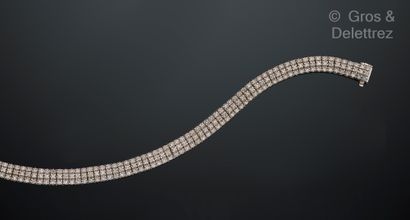 null Bracelet ligne en or gris 585 millièmes à maillons articulés ornés de trois...