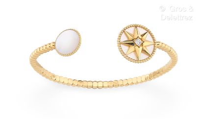DIOR, Collection « Rose des vents » Bracelet jonc ouvert en or jaune perlé 750 millièmes,...