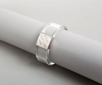 LOUIS VUITTON Bracelet jonc en composite transparent agrémenté d'un plaque en métal...