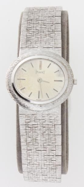 PIAGET Bracelet montre de dame en or gris, mouvement mécanique, bracelet souple en...