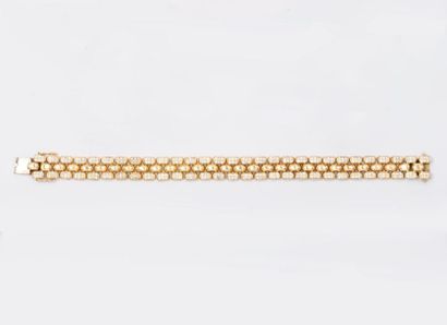 LUC POUR CHOPARD Bracelet articulé de trois rangs d'or jaune dont deux entièrement...