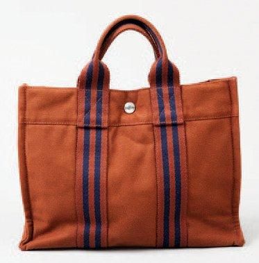 HERMÈS Paris made in France Sac "Mini toto bag" 30 cm en toile marron, fermetures...