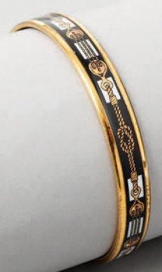 HERMES paris made in Austria Bracelet jonc en métal doré émaillé à décor d'épi de...