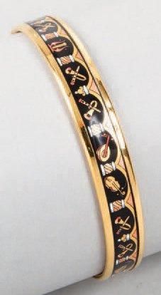 HERMES paris made in Austria Bracelet jonc en métal doré et émail à décor d'instruments...