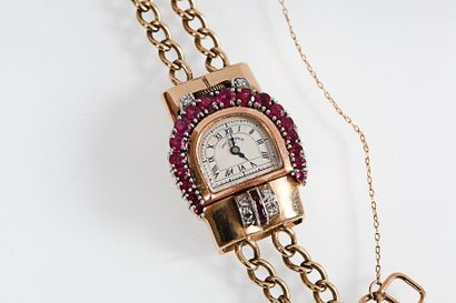 null Bracelet-montre de dame en or jaune 14K, la lunette sertie de rubis, et diamants...