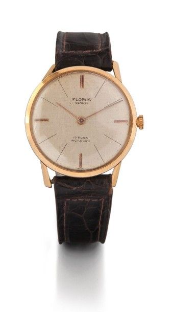 FLORUS N° 5223 vers 1960 Montre bracelet plate en or. Boîtier rond. Cadran crème,...