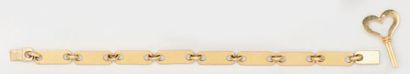 CARTIER Bracelet articulé en or jaune à maillons plaque avec clef d'ouverture en...