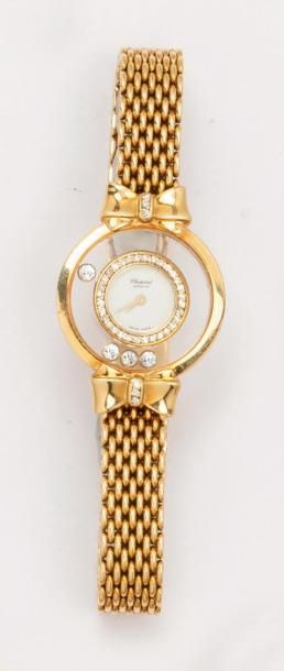 CHOPARD HAPPY DIAMONDS. Bracelet montre de dame en or jaune. La lunette ornée de...