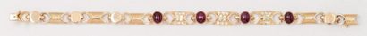 null Bracelet en or jaune orné de motifs «Noeud» sertis de diamants alternés de rubis...