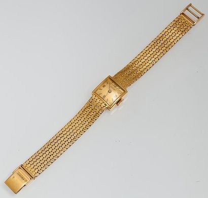 PERUDI Bracelet montre de dame en or jaune. Mouvement mécanique. Bracelet tressé...