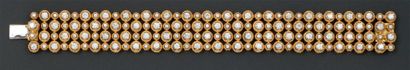 null Bracelet articulé en or jaune composé de quatre lignes serties de diamants taillés...