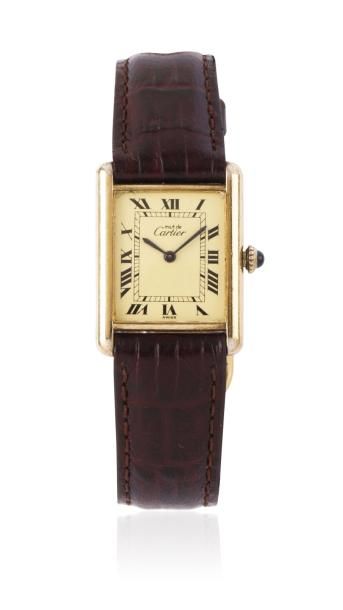 CARTIER TANK MUST n° 6169728 vers 1980 Montre bracelet rectangle en vermeil. Cadran...