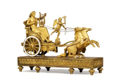null Pendule de cheminée en bronze ciselé et doré représentant Apollon sur un char...
