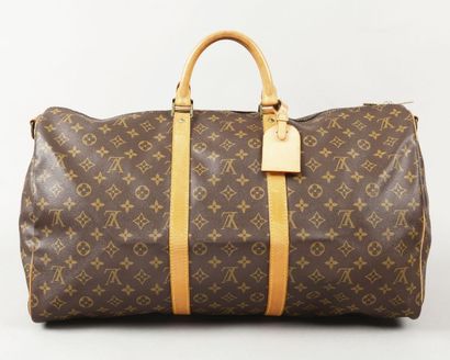 LOUIS VUITTON Sac «Keepall bandoulière» 55cm en toile monogram et cuir naturel, fermeture...