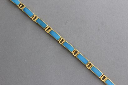 null Bracelet articulé en or jaune orné de turquoises. P. 21,5g.