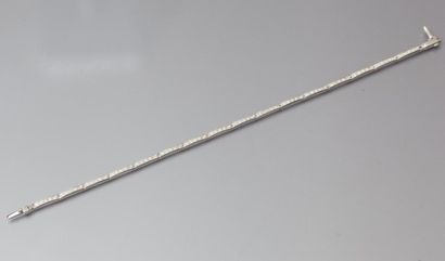 null Bracelet articulé en or gris orné de diamants taillés en brillant. P. 5,5g