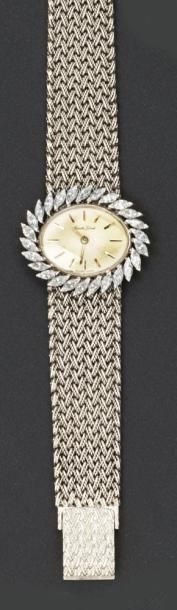 BUECHE GIROD Bracelet montre de dame en or gris, la lunette sertie de 26 diamants...