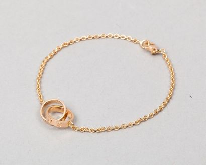 CARTIER Bracelet chaine en or rose 18K 750 millième agrémenté de deux anneaux love...