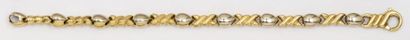 CHIMENTO Bracelet souple en or jaune et or gris. Signé Chimento. P. 11,8g