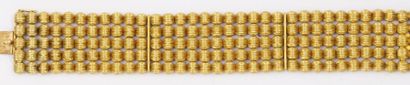 LALAOUNIS Bracelet souple orné de cinq rangs de boules d'or jaune godronnées. Poinçon...