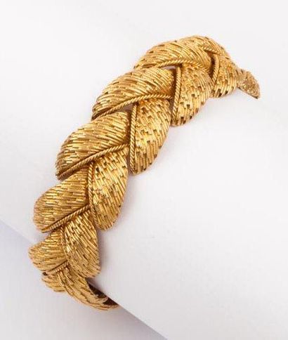 null Bracelet articulé en or jaune strié. P. 65g