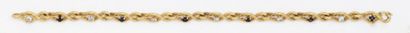 null Bracelet articulé en or jaune orné de saphirs alternés de diamants taillés en...