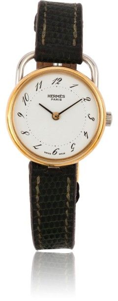 HERMES Arceau vers 1990. Belle montre bracelet de dame en acier. Lunette or. Cadran...