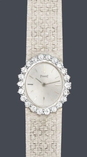 PIAGET Bracelet montre de dame en or gris, cadran argent, index bâtonnets, lunette...