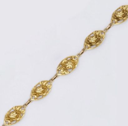 null Bracelet articulé en or jaune à motifs floraux. P. 17,7g