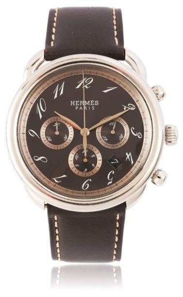 HERMES «Arceau» vers 2000 Grand chronographe bracelet en acier. Boîtier rond. Cadran...