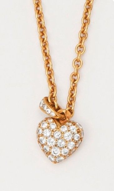CARTIER Chaîne et pendentif «coeur» en or jaune pavé de diamants taillés en brillant....