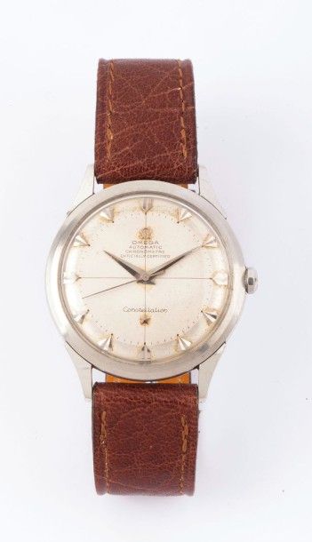 OMEGA 
Constellation vers 1950
Montre bracelet en acier. Boitier rond. Cadran argent,...