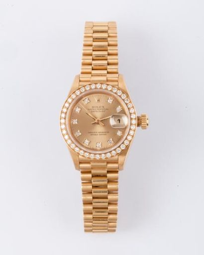 ROLEX- LADY DATEJUST OYSTER PERPETUAL Bracelet montre de dame en or jaune. Cadran...