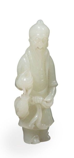 null Sujet en jade céladon représentant un pêcheur tenant un poisson. 
Chine, XIXème...
