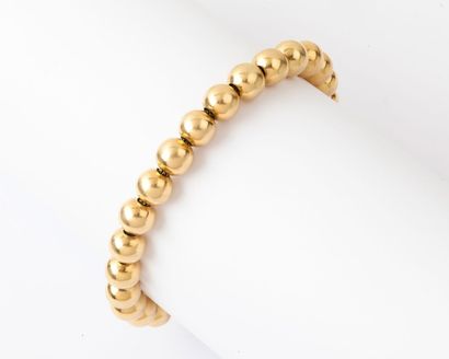 null Bracelet souple orné de boules d’or jaune. Longueur : 19 cm. P. 13,5 g.