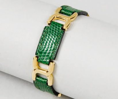 HERMES Paris made in France *Bracelet articulé en métal doré et lézard vert. Bon...
