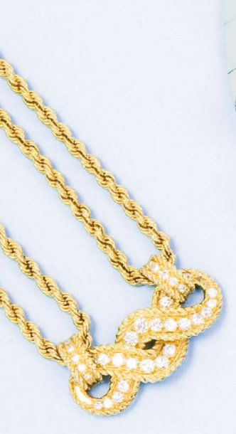 BOUCHERON Bracelet en or jaune orné d'un motif "Torsade" pavé de diamants. P. 24...