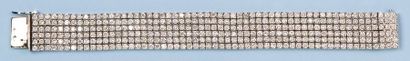 Edouard NAHUM Bracelet souple en or gris composé de six rangées de diamants taillés...