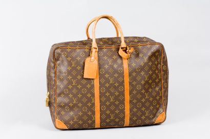 Louis VUITTON Valise "Sirius" en toile monogram, fermeture éclair et cadenas en laiton...