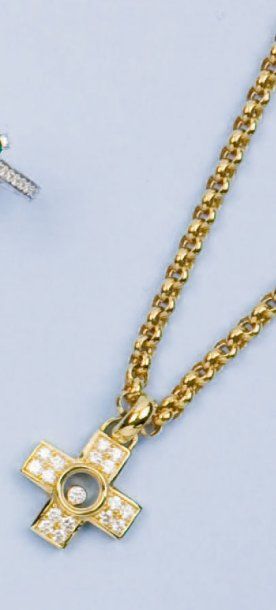 null CHOPARD - Chaîne et pendentif "Croix" en or jaune orné de diamants dont un mobile....