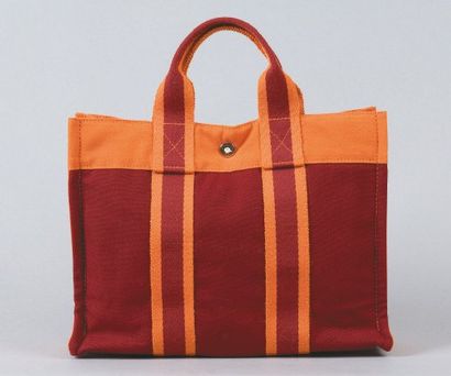 HERMÈS Paris made in France *Sac «Toto bag» en toile bicolore, fermeture pression,...