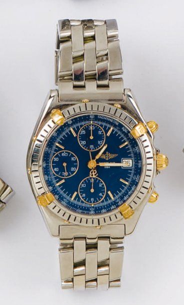 BREITLING - Bracelet montre chronographe en or jaune et acier. Cadran bleu à trois...
