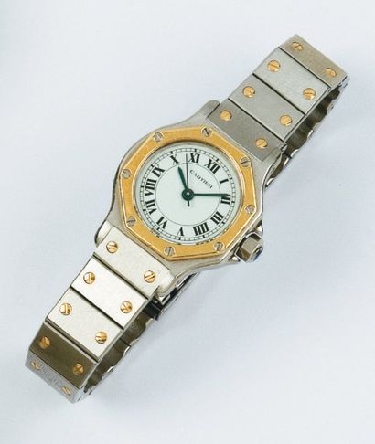 CARTIER - SANTOS Bracelet montre de dame en or jaune et acier. Cadran blanc. Trotteuse...