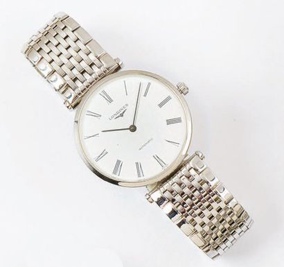 LONGINES : Bracelet-montre en acier. Cadran blanc à chiffres romains. Fond saphir....
