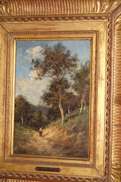 Jules DUPRE (1811-1889) Paysanne sur un chemin creux dans un paysage boisé Huile...