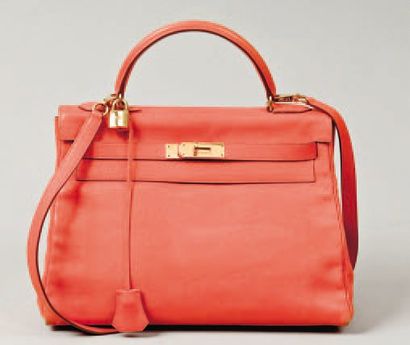 HERMÈS Paris made in France Sac « Kelly « 32 cm en cuir guliver orange, attaches...